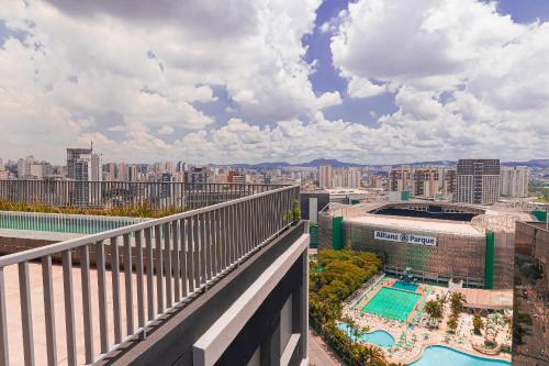 a balcony with a view of a city at Vossa Bossa Allianz in Sao Paulo