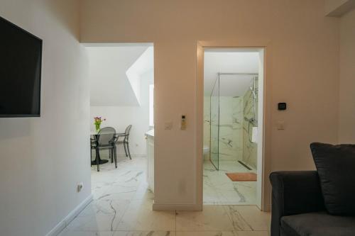 a living room with a glass door leading to a bathroom at BOUTIQUE APARTMENTS IMOTSKI, Imotski - Makarska in Imotski