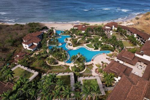 an aerial view of a resort near the ocean at JW Marriott Guanacaste Resort & Spa in Tamarindo