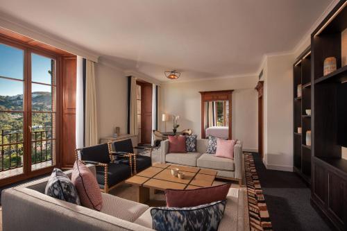 a living room with a couch and a table at Castillo Hotel Son Vida, a Luxury Collection Hotel, Mallorca in Palma de Mallorca