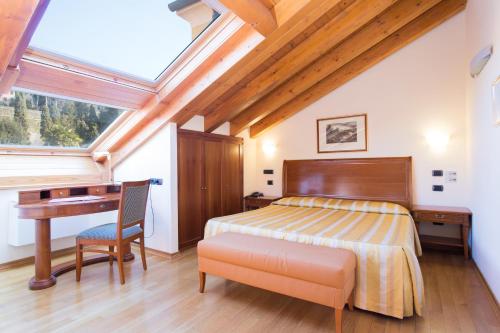 Postel nebo postele na pokoji v ubytování Grand Hotel Entourage - Palazzo Strassoldo