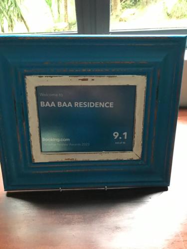 a blue tv frame with aesa barbara resilience sign at BAA BAA RESIDENCE in Hillcrest