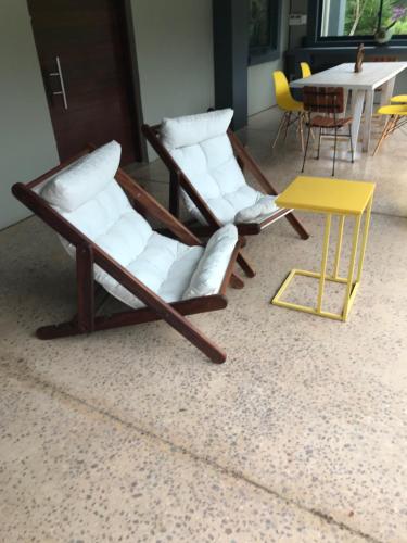 two chairs and a table in a room at BAA BAA RESIDENCE in Hillcrest