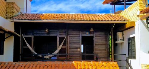 an outside view of a building with a porch at Pousada Sahara in Jericoacoara
