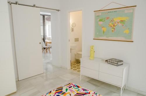 a bathroom with a map of the world on the wall at El Erizo Apartamentos in Tarifa