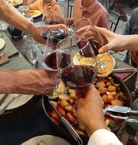 a group of people holding up glasses of wine at Apartments Desirée in Sutivan