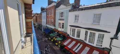 a view of a street from a balcony of a building at Brand New, Stunning, Central Old Town Balcony Flat in Hastings
