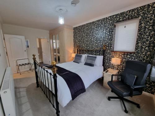 Katil atau katil-katil dalam bilik di Denham Guest House