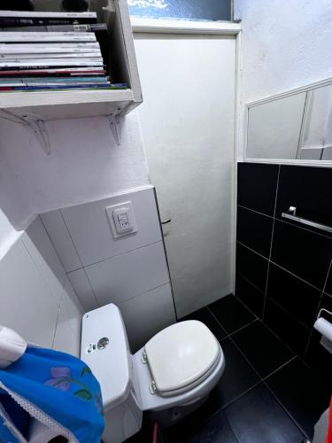 a small bathroom with a toilet and a shower at Winewalker in Ciudad Lujan de Cuyo
