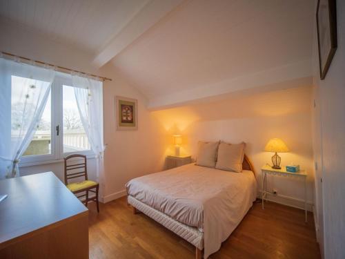 a small bedroom with a bed and a window at By les Climats - Gîte du Tacot - Gevrey-Chambertin in Gevrey-Chambertin