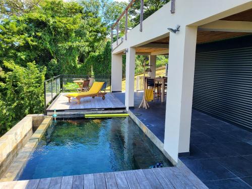 Πισίνα στο ή κοντά στο Appartement vue mer avec piscine privée à La Trinité, 98m²