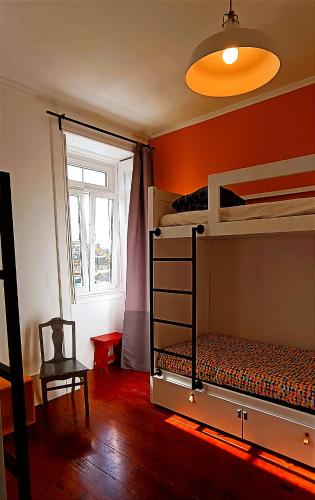 a bedroom with two bunk beds and a window at Aveiro Rossio Hostel in Aveiro