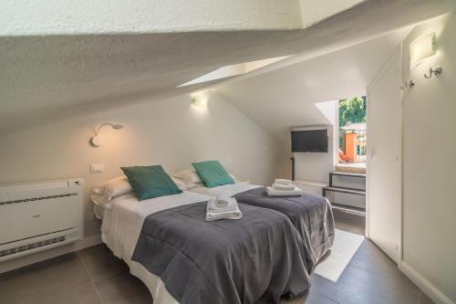 Postel nebo postele na pokoji v ubytování Stella by PortofinoHomes