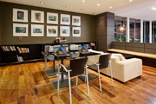 a living room with a table and a couch at Holiday Inn Santo Domingo by IHG in Santo Domingo