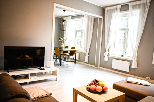 TV a/nebo společenská místnost v ubytování Moderne leilighet ved Solsiden i Trondheim
