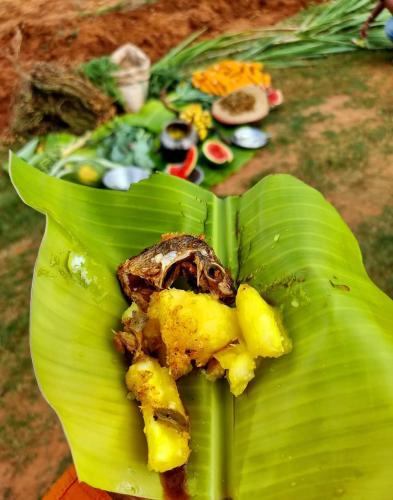 a green banana leaf with food on top of it at Moonshade Handapanagala in Monaragala
