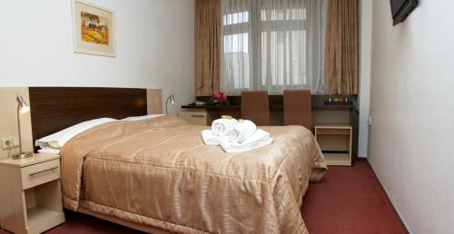 Postel nebo postele na pokoji v ubytování Hotel Expo
