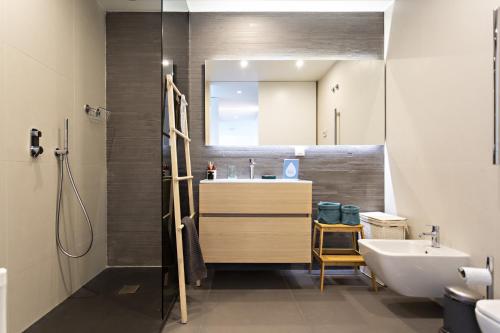 a bathroom with a sink and a mirror at My Ocean View in Cabanas de Tavira