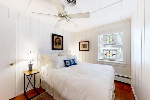 a white bedroom with a bed and a ceiling fan at Town of Rehoboth Beach --- 51 Olive Ave in Rehoboth Beach
