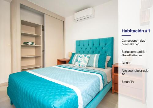 a bedroom with a blue bed and a closet at Ambar Condominios Mazatlan in Mazatlán
