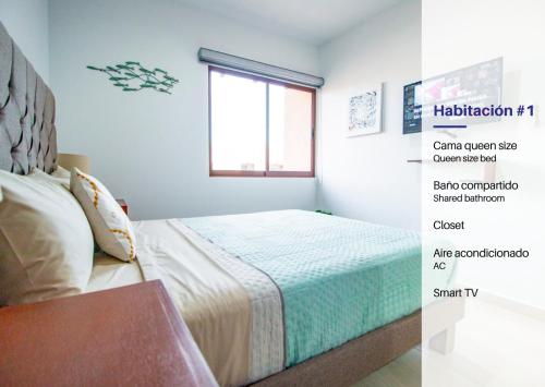 a bedroom with a bed and a window at Ambar Condominios Mazatlan in Mazatlán