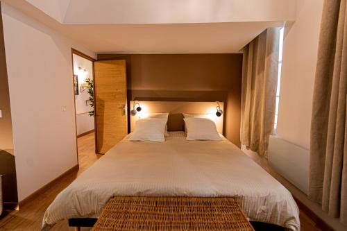 Posteľ alebo postele v izbe v ubytovaní Loft au bèu mitan - 50m2