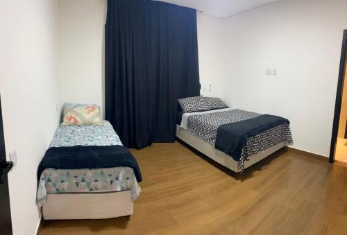Ein Bett oder Betten in einem Zimmer der Unterkunft Casa de Campo na Represa de Paranapanema Riviera de Sta Cristina XIII