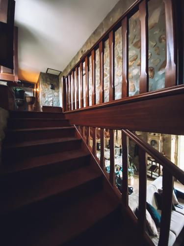 a staircase leading up to a room with a bed at Casa da Tanquinha in Beiral do Lima