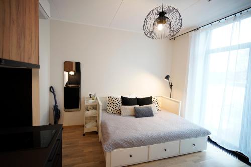 Postel nebo postele na pokoji v ubytování Riia Kvartal Apartment