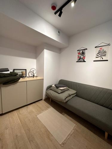 a living room with a couch and a bed at C53 in Warsaw