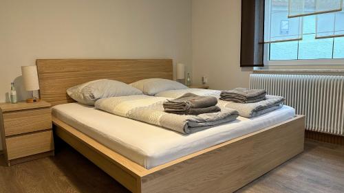 a bedroom with a bed with towels on it at Ferienwohnung zum Winterberg in Elsterwerda