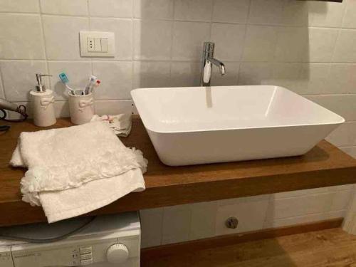 a white sink on a counter in a bathroom at appartamento valtournenche il nido in Valtournenche