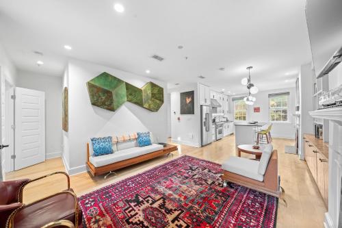 a living room with a couch and a rug at The Graham Georgetown in Washington, D.C.