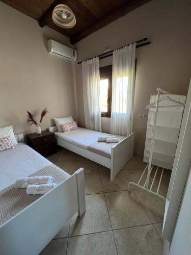 Postel nebo postele na pokoji v ubytování Serenity Resort