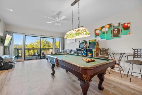 a living room with a pool table in it at Hot Springs Vacation Rental with Game Room! in Hot Springs