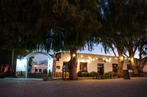 a building with a tree in front of it at Tampu in Cachí