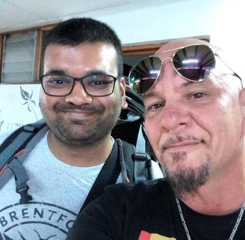 two men standing next to each other wearing sunglasses at Arenal Poshpacker in Fortuna