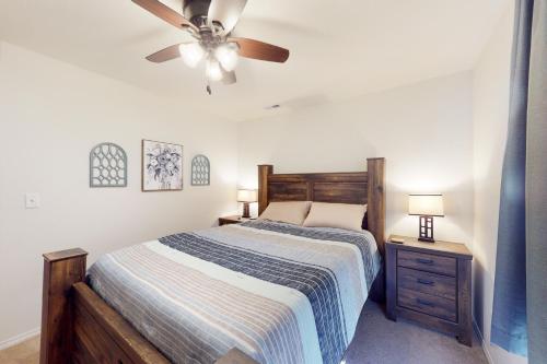 a bedroom with a bed and a ceiling fan at Tanner's Retreat in Branson