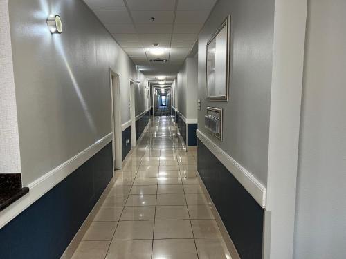 a hallway in a hospital with a long aisle at La Quinta by Wyndham Alvarado in Alvarado