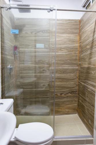a bathroom with a shower with a toilet at Markasa Hotel boutique in Cartagena de Indias