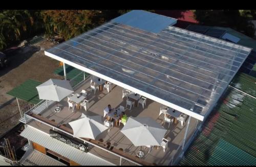 an overhead view of a house with solar panels on it at Hotel Divisamar by LHR in Manuel Antonio