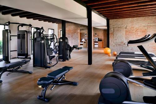 a gym with several treadmills and cardio machines at JW Marriott Venice Resort & Spa in Venice