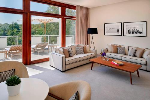 a living room with two couches and a table at JW Marriott Venice Resort & Spa in Venice