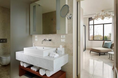 a bathroom with a sink and a mirror at JW Marriott Venice Resort & Spa in Venice