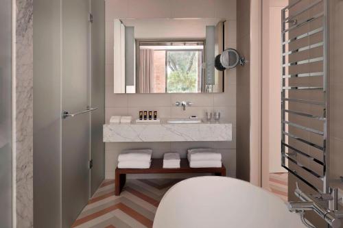 a bathroom with a sink and a mirror at JW Marriott Venice Resort & Spa in Venice