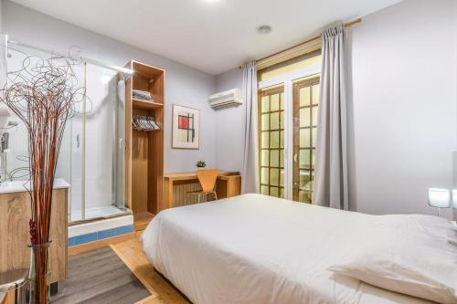 Postel nebo postele na pokoji v ubytování MyHouseSpain - Fuencarral and Gran Vía