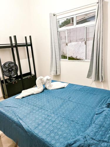 Ένα ή περισσότερα κρεβάτια σε δωμάτιο στο Temporada em Miguel Pereira