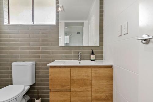 a bathroom with a sink and a toilet at Coorumbong 14 in Mooloolaba