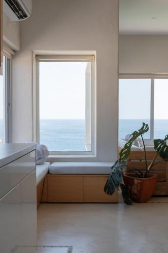 a kitchen with a window seat with a potted plant at Casa Roni by Xeno - 5 Bedroom Luxury Villa with Ocean View in Playa Estacahuite
