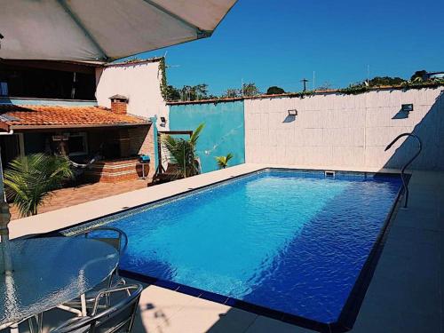 Casa com piscina e Sala de Jogos